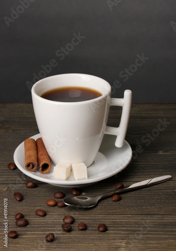 Fototapeta Naklejka Na Ścianę i Meble -  Coffee cup on wooden table on grey background