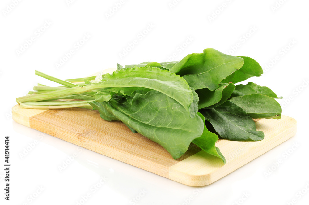 Fresh sorrel on wooden board isolated on white Fresh sorrel on wooden board isolated on white