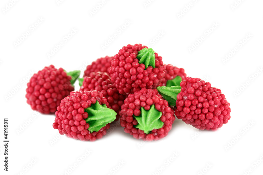 red candy raspberries isolated on white red candy raspberries isolated on white