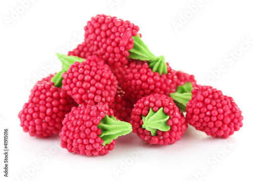 red candy raspberries isolated on white