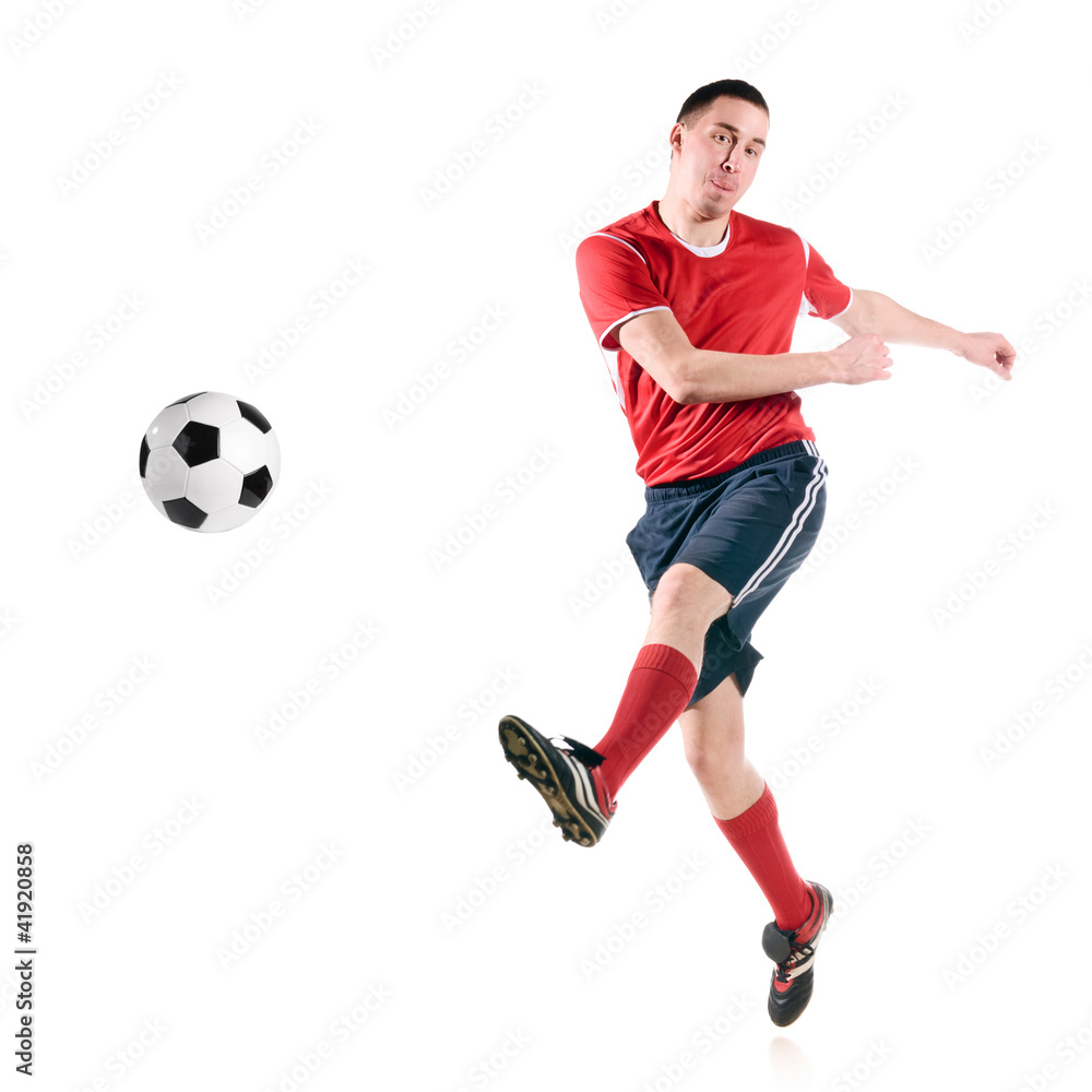 soccer player hits the ball