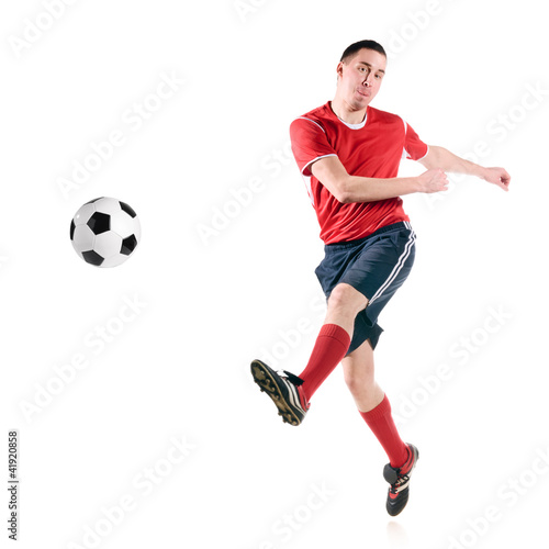 soccer player hits the ball