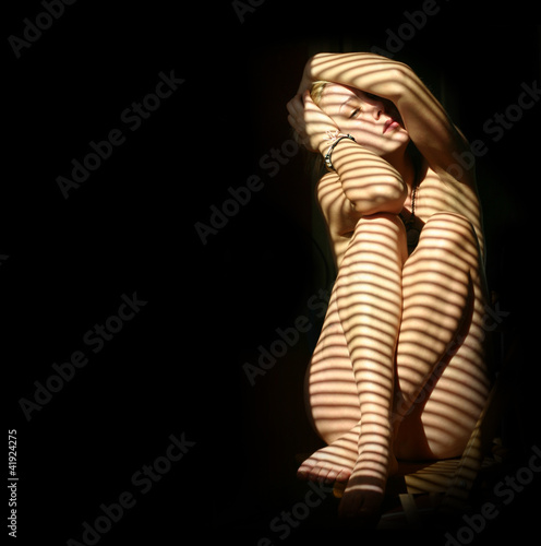 nude woman in the dark