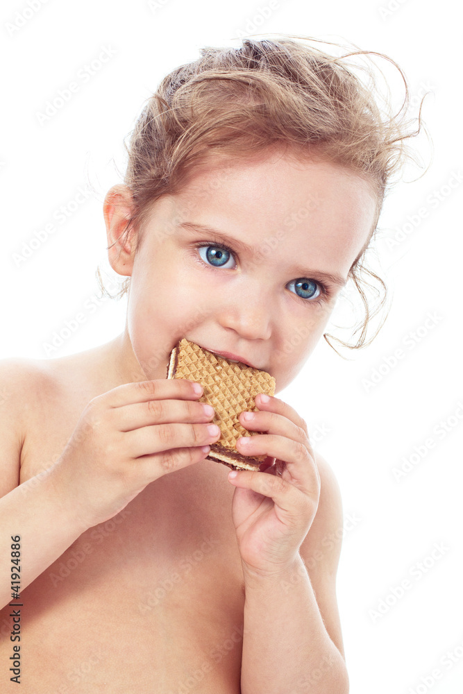 Beautiful sweet little girl eating a cookie Beautiful sweet little girl eating a cookie
