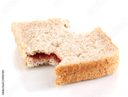 Bitten sandwich with jam isolated on white