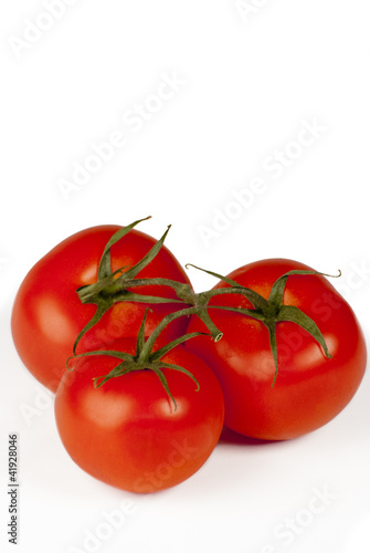 Three tomotoes on white background