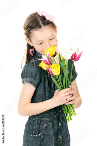 Portrait of beautiful little girl with tulips isolated on white