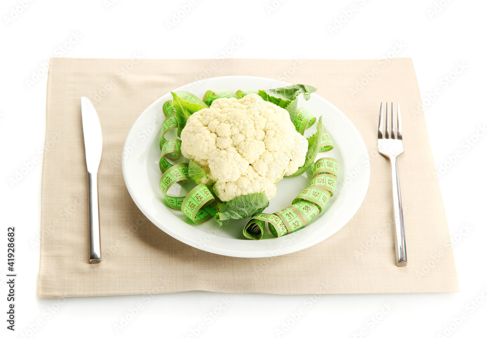Fresh cauliflower and measuring tape Fresh cauliflower and measuring tape