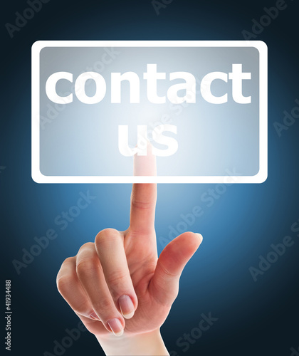 hand pushing contact us button