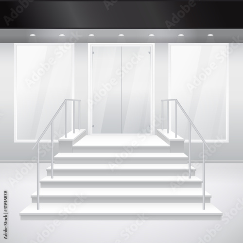 Entry to shop with stairs. Exterior of store in gray color