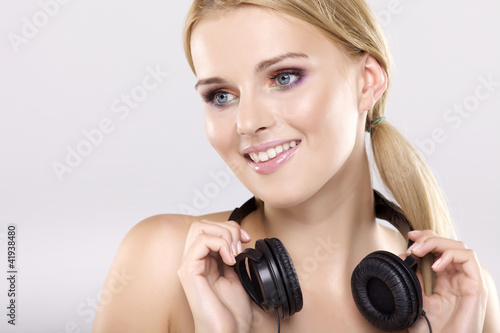 Beautiful girl is listen to the music