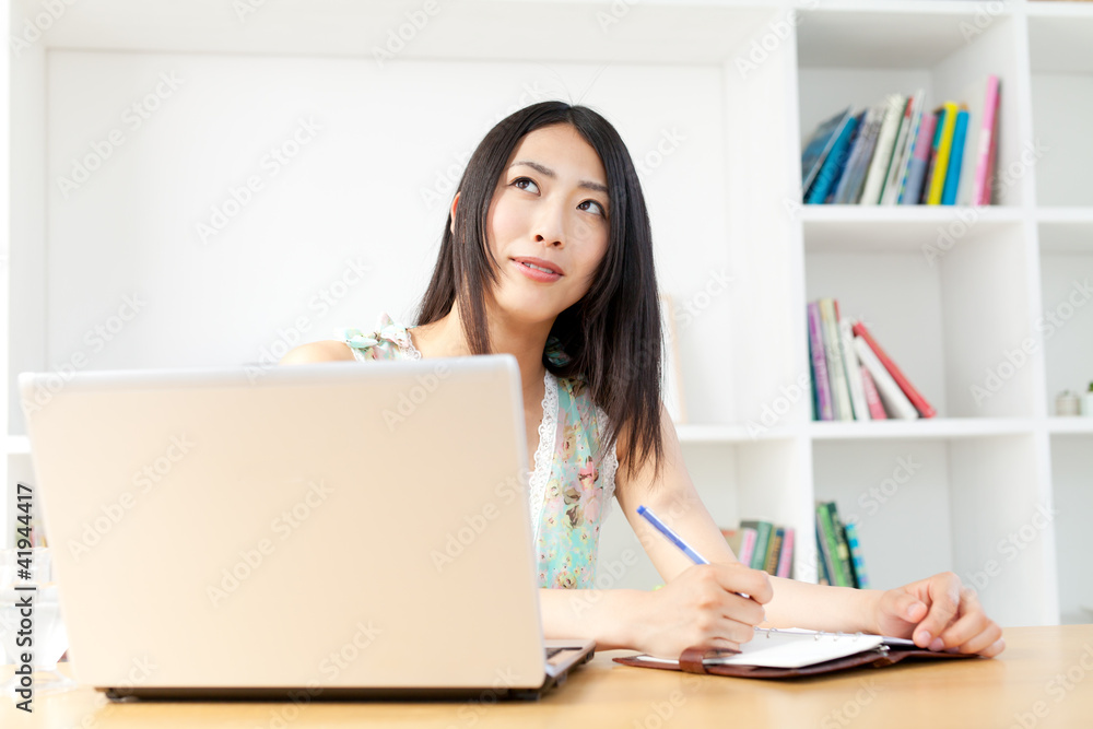 Beautiful young woman using a laptop computer Beautiful young woman using a laptop computer