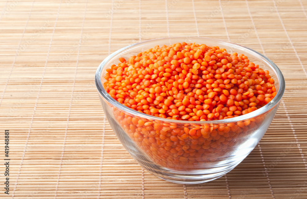 glass bowl full of red lentils glass bowl full of red lentils