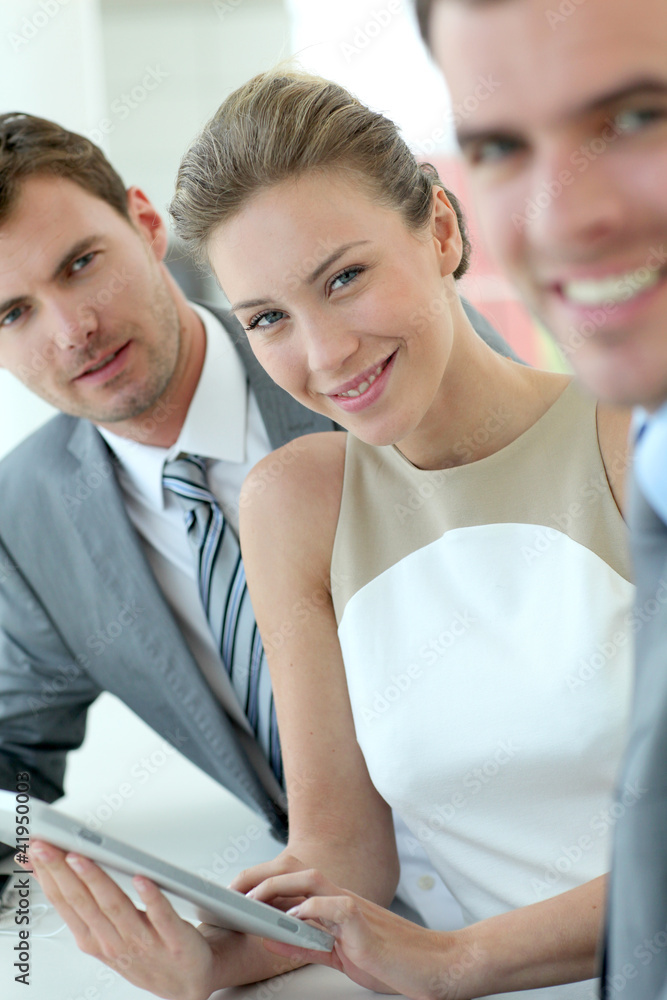 Businesswoman attending meeting with colleagues Businesswoman attending meeting with colleagues