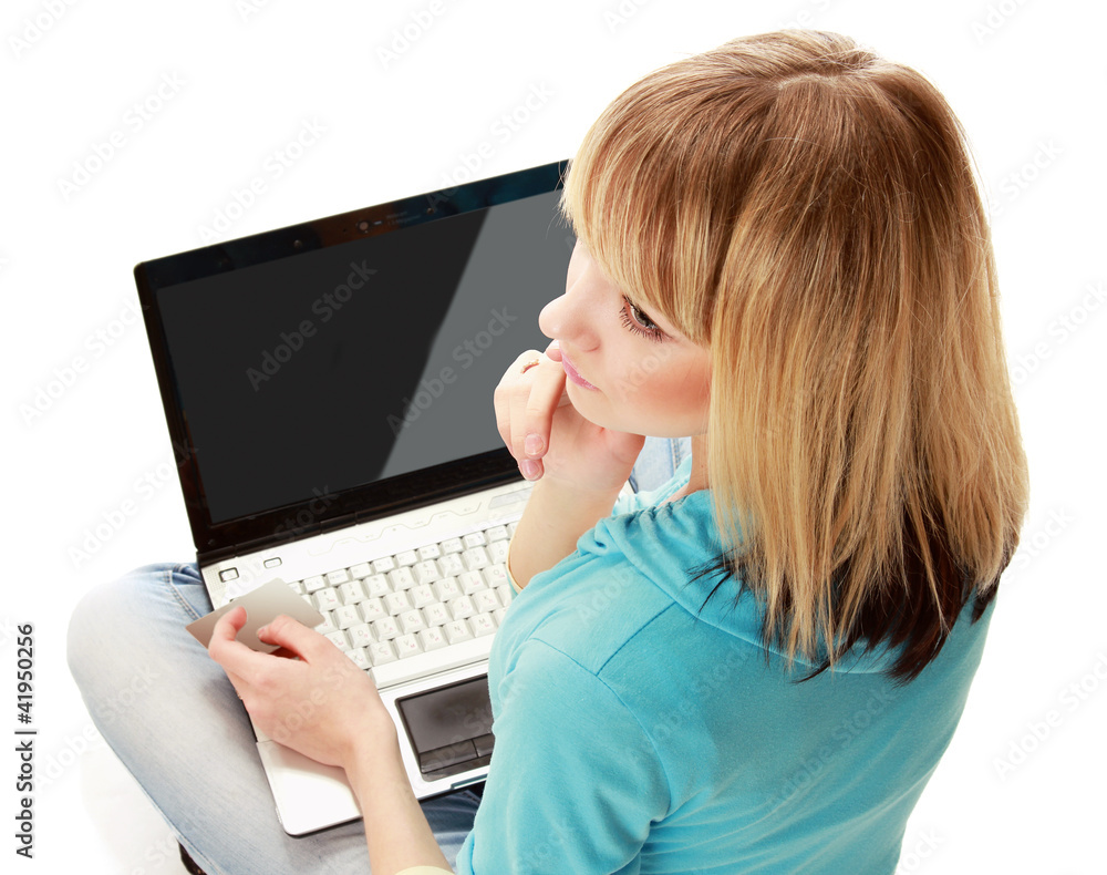 Back view of a woman holding a credit card Back view of a woman holding a credit card