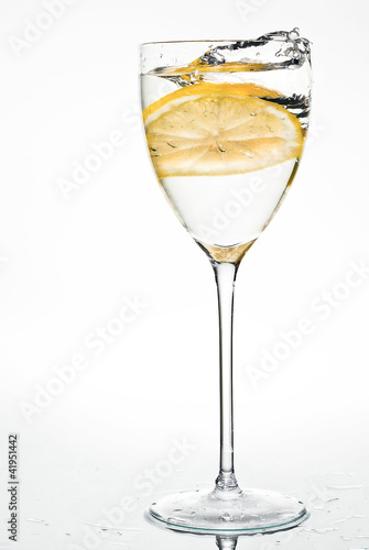 Water with lemon, splash in glass
