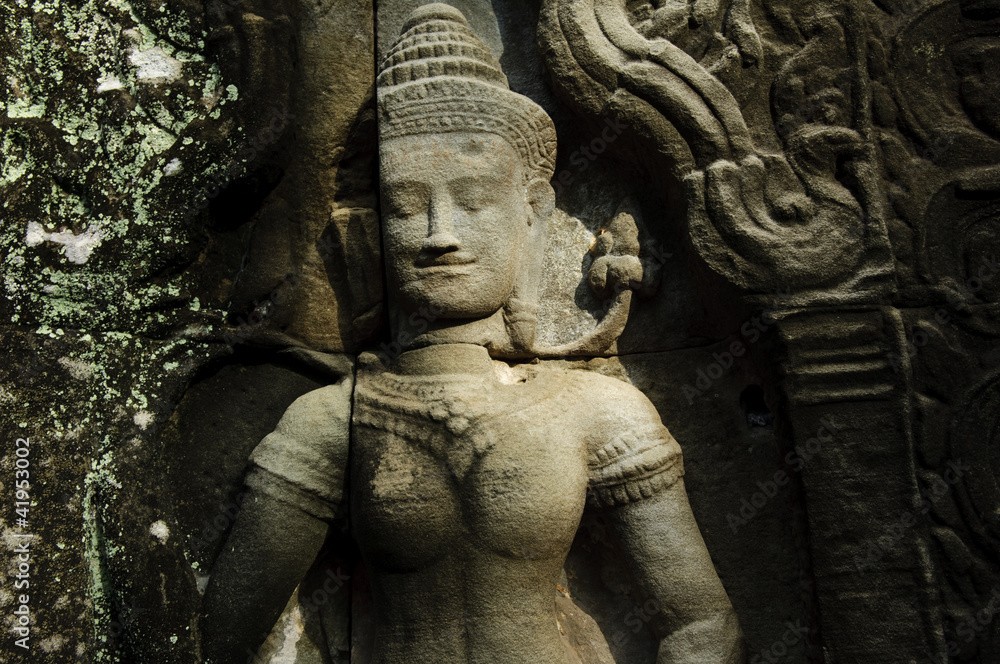 an apsara statue in a temple, cambodia