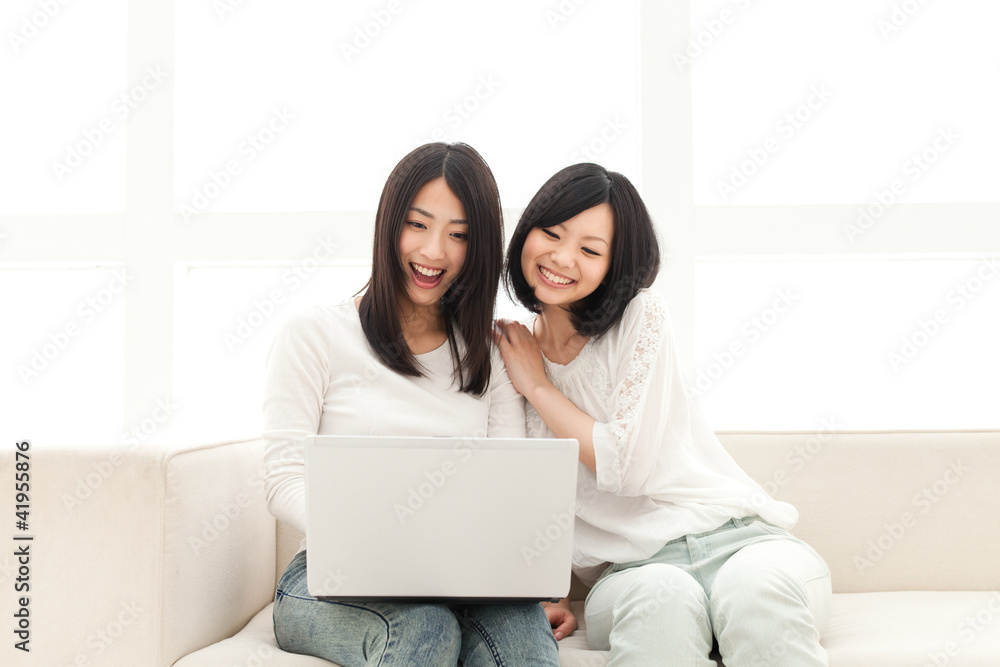 Beautiful young women using a laptop computer. Portrait of asian Beautiful young women using a laptop computer. Portrait of asian