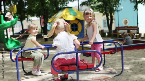 Three happy girls on the playground