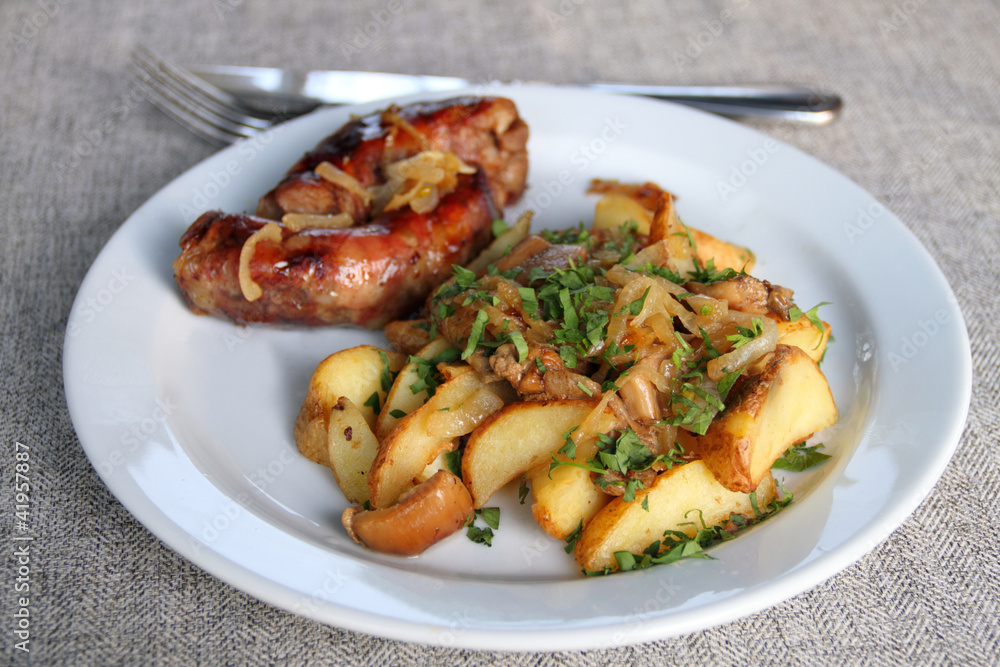 Roasred potato with onion and homemade sausage Roasred potato with onion and homemade sausage