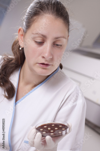 Lab scientist with petri dish
