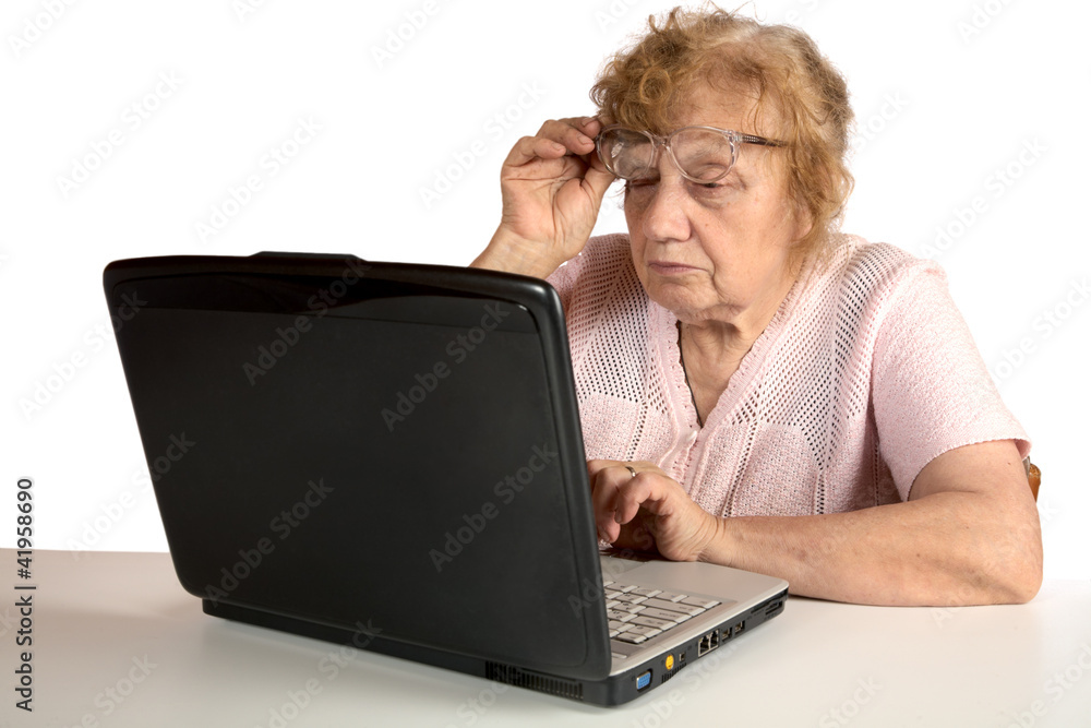 Granny with the laptop isolated on a white Granny with the laptop isolated on a white