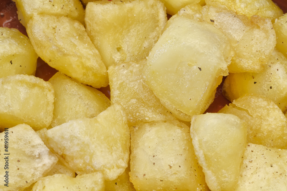 Fried pieces of potatoes Fried pieces of potatoes