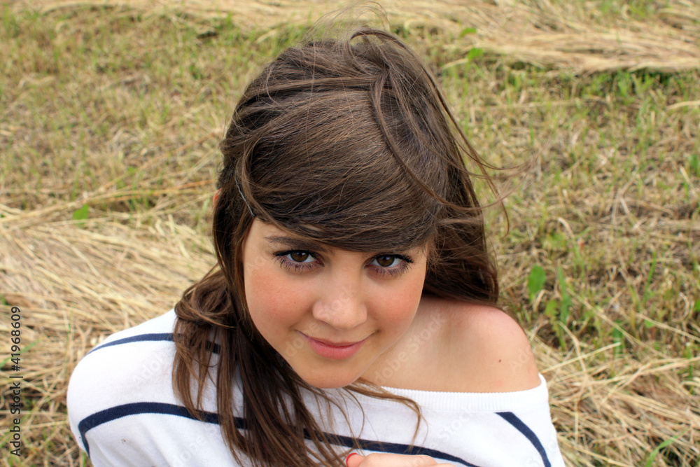 portrait of young beautiful teen on the meadow closeup portrait of young beautiful teen on the meadow closeup