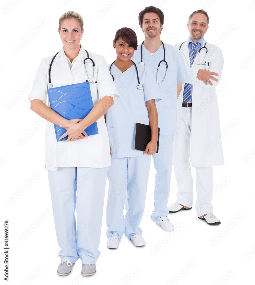 Group of doctors standing together over white Group of doctors standing together over white