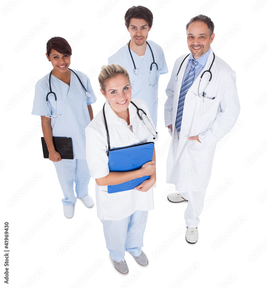 Group of doctors standing together over white Group of doctors standing together over white