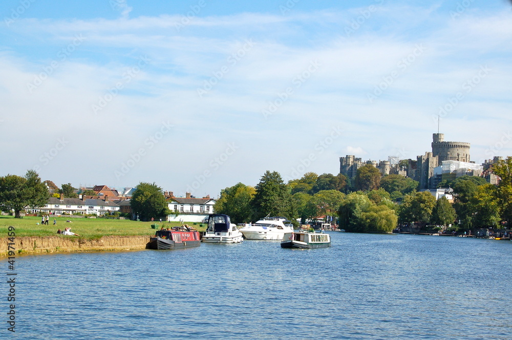 Boats on River Thames, London with Windsor Castle in background