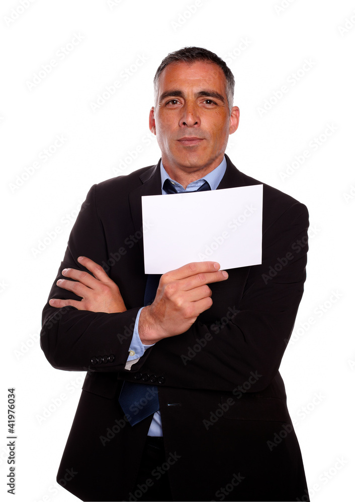 Mature business man holding a white card Mature business man holding a white card