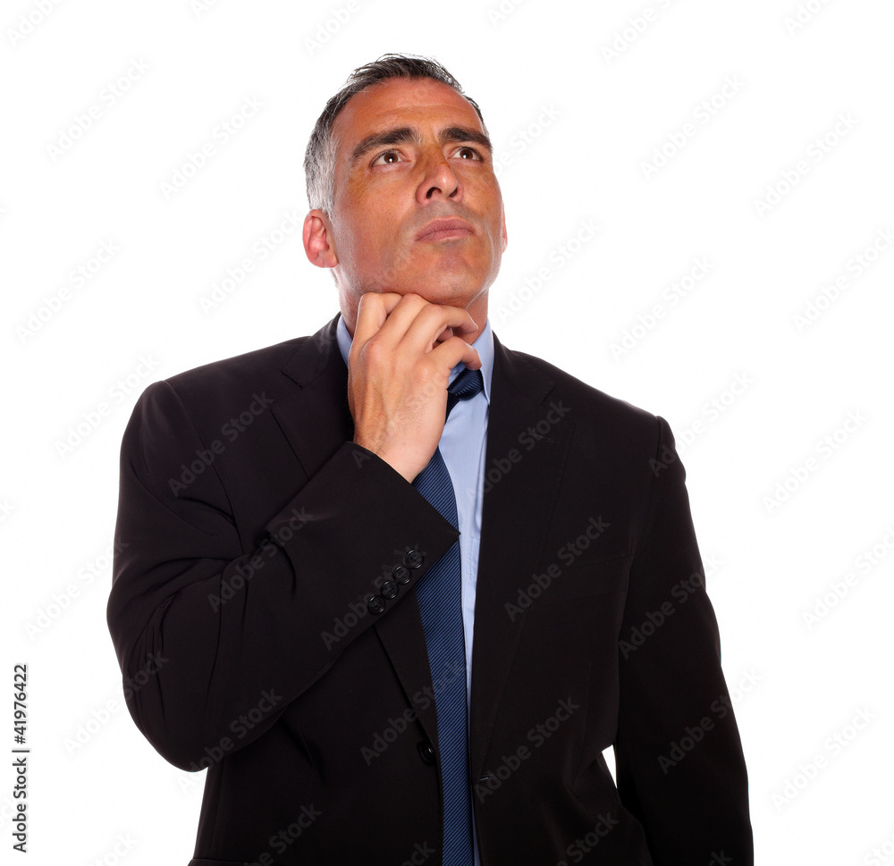 Meditative businessman touching the chin Meditative businessman touching the chin