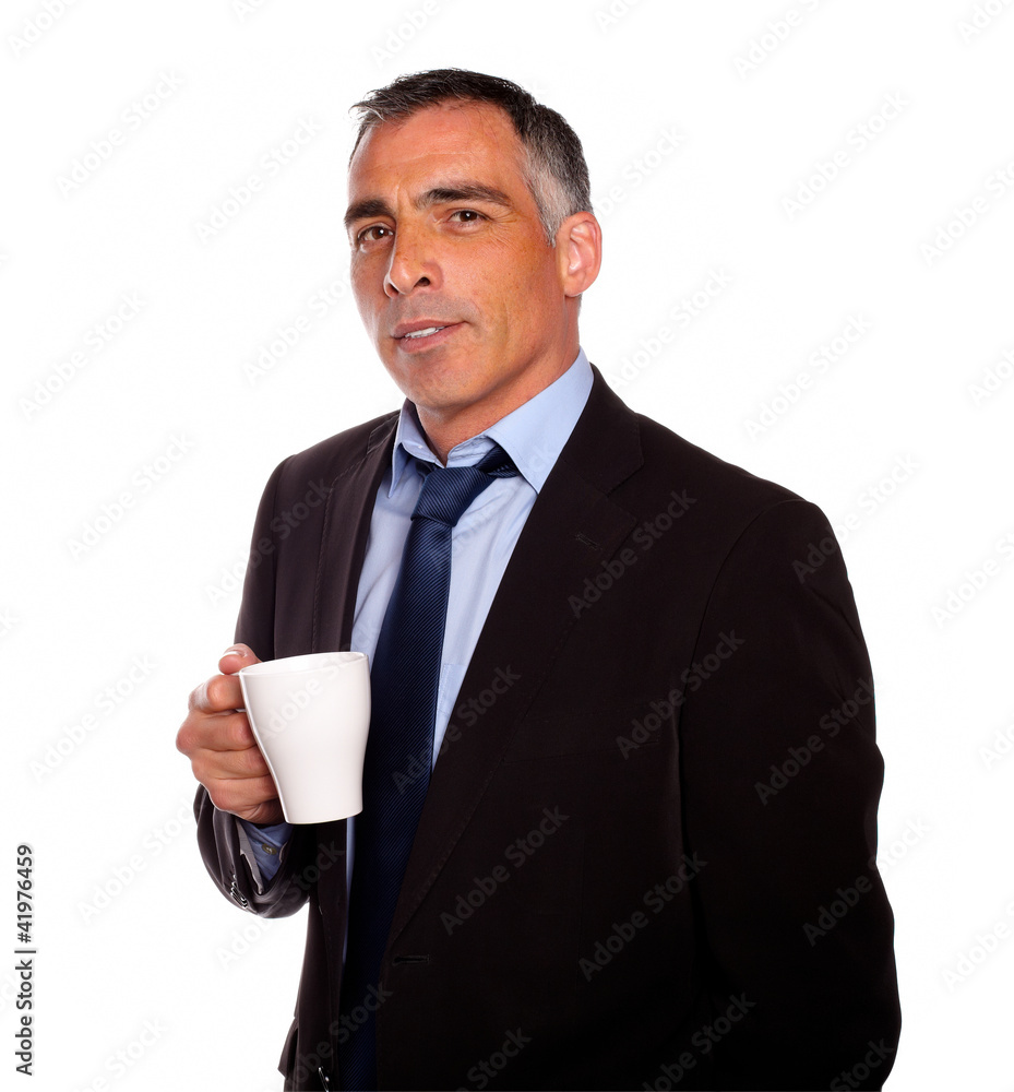 Reflective charming man with a white mug Reflective charming man with a white mug