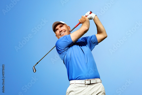 golfer shooting a golf ball