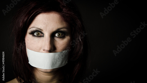 Woman with duct tape over mouth