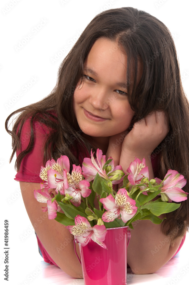 Asian miling girl at the age of twelve with pink flowers Asian miling girl at the age of twelve with pink flowers