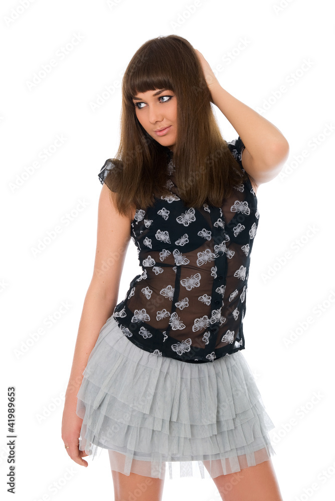 Portrait of a stunning young woman posing in short skirt and blo Portrait of a stunning young woman posing in short skirt and blo