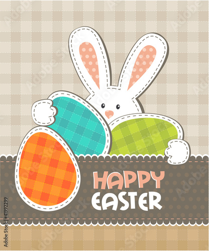 Greeting card. Easter bunny with colored eggs