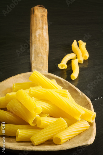 raw pasta over vintage spoon