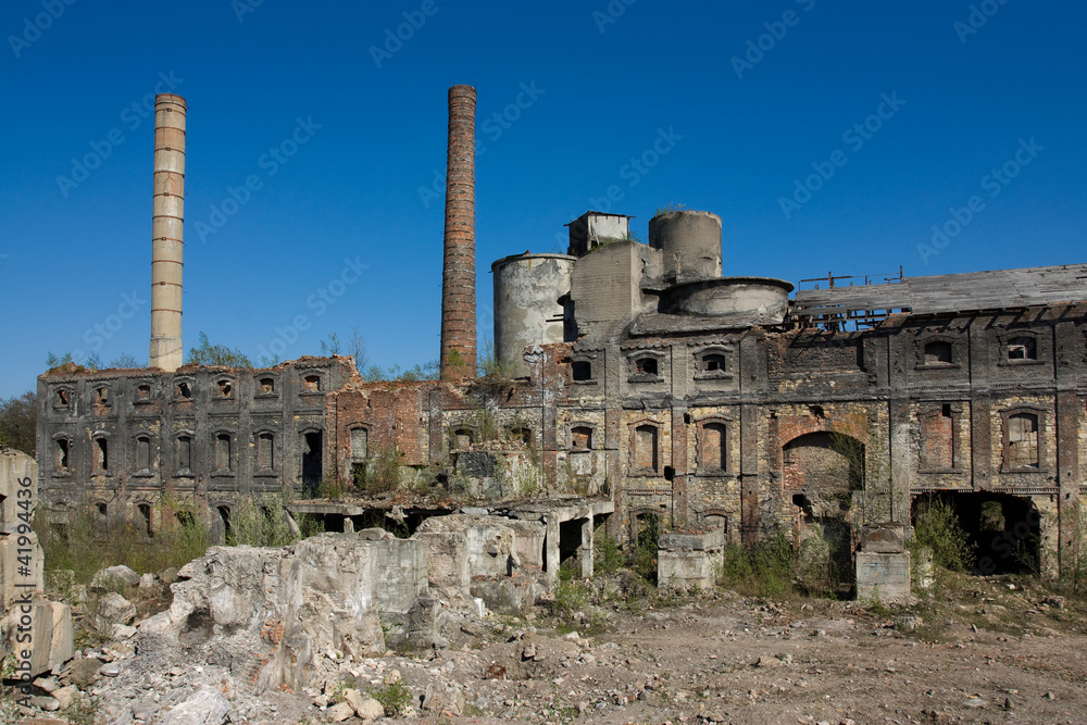 abandoned buildings, industrial ruins on blue sky background