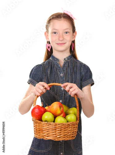beautiful little girl holding basket of apples isolated on