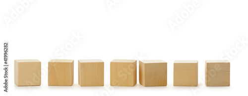 Wooden cubes in row photo