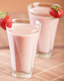 Smoothie strawberry served with fresh strawberry