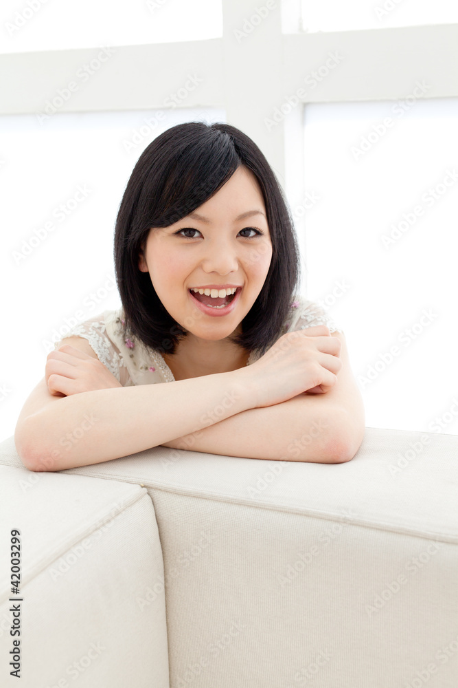 Beautiful young woman relaxing living room. Portrait of asian. Beautiful young woman relaxing living room. Portrait of asian.