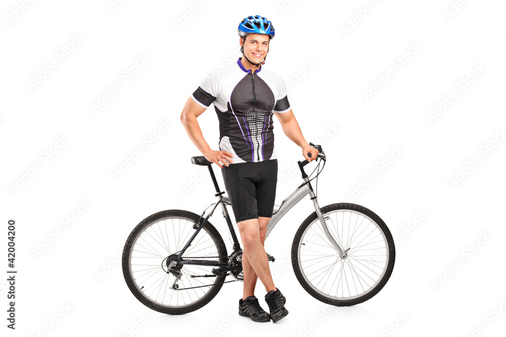 Smiling bicyclist posing next to a bicycle Smiling bicyclist posing next to a bicycle