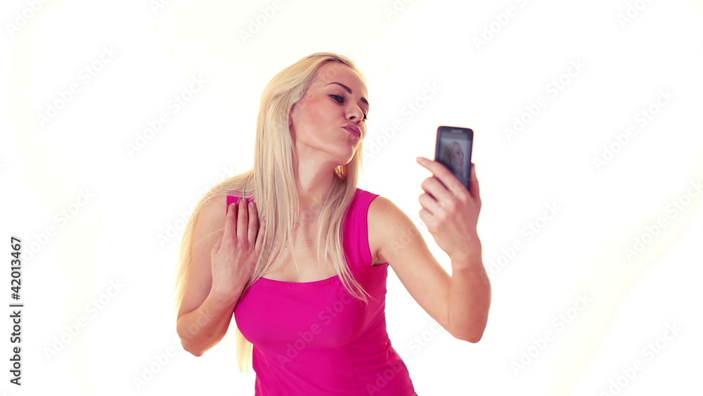 young blonde woman taking photos of yourself by mobile phone young blonde woman taking photos of yourself by mobile phone