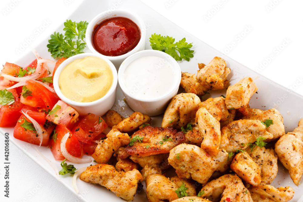 Grilled meat and vegetables on white background Grilled meat and vegetables on white background