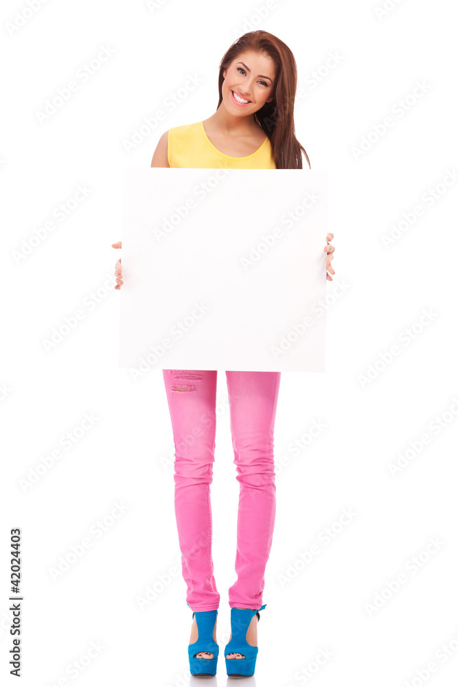smiling young woman with blank bill board smiling young woman with blank bill board