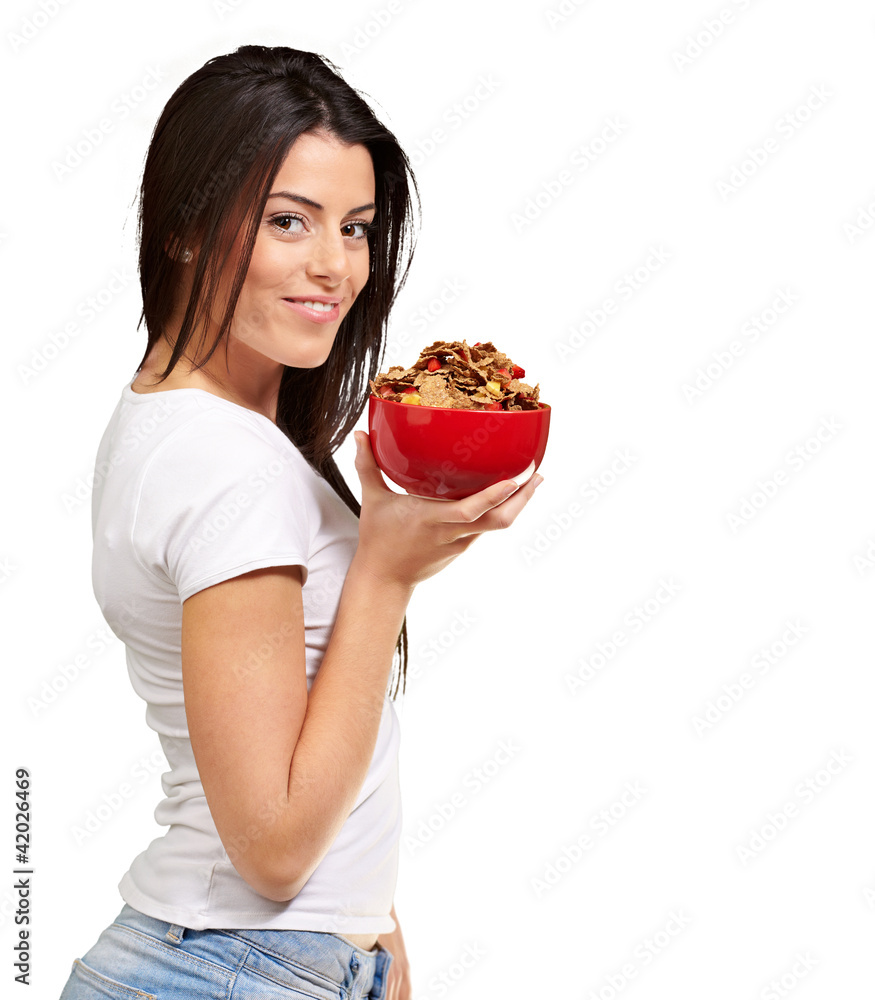 portrait of young woman holding a cereal bowl over white backgro portrait of young woman holding a cereal bowl over white backgro